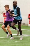 Justin Rennicks (12), Wilfried Zahibo (23) during New England Revolution first 2020 Training Session at the Field House Gillette Stadium in Foxboro, MA on Monday, January 20, 2020. CREDIT/ CHRIS ADUAMA.
