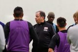 Head Coach Bruce Arena and players