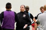 Head Coach Bruce Arena and players