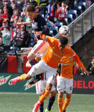 Kalyn Rowe (11) and Mauro Manotas (19) during New England Revolution and Houston Dynamo MLS match at Gillette Stadium in Foxboro, MA on Saturday, April 8, 2017.  Revs won 2-0 CREDIT/ CHRIS ADUAMA