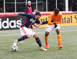 Lee Nguyen (24) and Boniek Garcia (27) during New England Revolution and Houston Dynamo MLS match at Gillette Stadium in Foxboro, MA on Saturday, April 8, 2017.  Revs won 2-0 CREDIT/ CHRIS ADUAMA