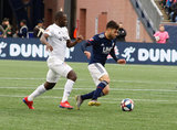 Kekuta Manneh (31), Carles Gil (22) during New England Revolution and FC Cincinnati MLS match at Gillette Stadium in Foxboro, MA on Sunday, March 24, 2019. The match ended in 2-0 win for FC Cincinnati. CREDIT/ CHRIS ADUAMA