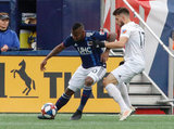Cristian Penilla (70), Mathieu Deplagne (17) during New England Revolution and FC Cincinnati MLS match at Gillette Stadium in Foxboro, MA on Sunday, March 24, 2019. The match ended in 2-0 win for FC Cincinnati. CREDIT/ CHRIS ADUAMA