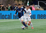 Carles Gil (22), Greg Garza (4) during New England Revolution and FC Cincinnati MLS match at Gillette Stadium in Foxboro, MA on Sunday, March 24, 2019. The match ended in 2-0 win for FC Cincinnati. CREDIT/ CHRIS ADUAMA