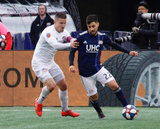 Greg Garza (4), Carles Gil (22) during New England Revolution and FC Cincinnati MLS match at Gillette Stadium in Foxboro, MA on Sunday, March 24, 2019. The match ended in 2-0 win for FC Cincinnati. CREDIT/ CHRIS ADUAMA
