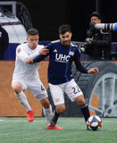 Greg Garza (4), Carles Gil (22) during New England Revolution and FC Cincinnati MLS match at Gillette Stadium in Foxboro, MA on Sunday, March 24, 2019. The match ended in 2-0 win for FC Cincinnati. CREDIT/ CHRIS ADUAMA