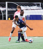 DeJuan Jones (24), Roland Lamah (7) during New England Revolution and FC Cincinnati MLS match at Gillette Stadium in Foxboro, MA on Sunday, March 24, 2019. The match ended in 2-0 win for FC Cincinnati. CREDIT/ CHRIS ADUAMA
