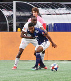 DeJuan Jones (24), Roland Lamah (7) during New England Revolution and FC Cincinnati MLS match at Gillette Stadium in Foxboro, MA on Sunday, March 24, 2019. The match ended in 2-0 win for FC Cincinnati. CREDIT/ CHRIS ADUAMA