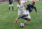 Cristian Penilla (70), Greg Garza (4) during New England Revolution and FC Cincinnati MLS match at Gillette Stadium in Foxboro, MA on Sunday, March 24, 2019. The match ended in 2-0 win for FC Cincinnati. CREDIT/ CHRIS ADUAMA