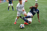 Cristian Penilla (70), Greg Garza (4) during New England Revolution and FC Cincinnati MLS match at Gillette Stadium in Foxboro, MA on Sunday, March 24, 2019. The match ended in 2-0 win for FC Cincinnati. CREDIT/ CHRIS ADUAMA
