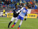 Cristian Colman (9) and Jalil Anibaba (3) during New England Revolution and FC Dallas MLS match at Gillette Stadium in Foxboro, MA on Saturday, April 14, 2018. Revs lost 0-1. CREDIT/ CHRIS ADUAMA