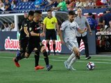Eduard Atuesta (20), Carles Gil (22) during New England Revolution and Los Angeles Football Club MLS match at Gillette Stadium in Foxboro, MA on Saturday, August 3, 2019. LAFC won 2-0. CREDIT/CHRIS ADUAMA