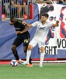 Adama Diomande (99), Carles Gil (22) during New England Revolution and Los Angeles Football Club MLS match at Gillette Stadium in Foxboro, MA on Saturday, August 3, 2019. LAFC won 2-0. CREDIT/CHRIS ADUAMA