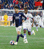 Carles Gil (22), Orji Okwonkwo (18) during New England Revolution and Montreal Impact MLS match at Gillette Stadium in Foxboro, MA on Wednesday, April 24, 2019. Montreal beat Revs 3-0. CREDIT/ CHRIS ADUAMA