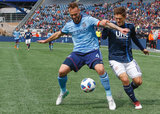 Maxime Chanot (4) and Kelyn Rowe (11) during Revolution and NYCFC MLS match at Gillette Stadium in Foxboro, MA on Saturday, March 24, 2018. The match ended 2-2. CREDIT/ CHRIS ADUAMA