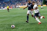 Andrew Farrell (2), Sergio Santos (17) during New England Revolution and Philadelphia Union MLS match at Gillette Stadium in Foxboro, MA on Wednesday, June 26, 2019. The match ended in 1-1 tie. CREDIT/CHRIS ADUAMA