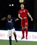 Andrew Farrell (2), Patrick Mullins (13) during New England Revolution and Toronto FC MLS match at Gillette Stadium in Foxboro, MA on Saturday, August 31, 2019. The match ended in 1-1 tie. CREDIT/ CHRIS ADUAMA