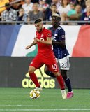 Alejandro Pozuelo (10), Wilfried Zahibo (23) during New England Revolution and Toronto FC MLS match at Gillette Stadium in Foxboro, MA on Saturday, August 31, 2019. The match ended in 1-1 tie. CREDIT/ CHRIS ADUAMA