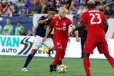 Juan Agudelo (17), Michael Bradley (4) during New England Revolution and Toronto FC MLS match at Gillette Stadium in Foxboro, MA on Saturday, August 31, 2019. The match ended in 1-1 tie. CREDIT/ CHRIS ADUAMA
