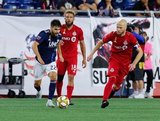 Carles Gil (22), Michael Bradley (4) during New England Revolution and Toronto FC MLS match at Gillette Stadium in Foxboro, MA on Saturday, August 31, 2019. The match ended in 1-1 tie. CREDIT/ CHRIS ADUAMA