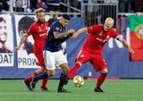 Nick DeLeon (18), Gustavo Bou (7), Michael Bradley (4) during New England Revolution and Toronto FC MLS match at Gillette Stadium in Foxboro, MA on Saturday, August 31, 2019. The match ended in 1-1 tie. CREDIT/ CHRIS ADUAMA