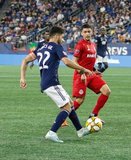 Juan Agudelo (17), Auro (96) during New England Revolution and Toronto FC MLS match at Gillette Stadium in Foxboro, MA on Saturday, August 31, 2019. The match ended in 1-1 tie. CREDIT/ CHRIS ADUAMA