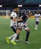 Erik Godoy (22), Teal Bunbury (10) during New England Revolution and Vancouver Whitecaps FC MLS match at Gillette Stadium in Foxboro, MA on Wednesday, July 17, 2019.  Revs won 4-0. CREDIT/CHRIS ADUAMA